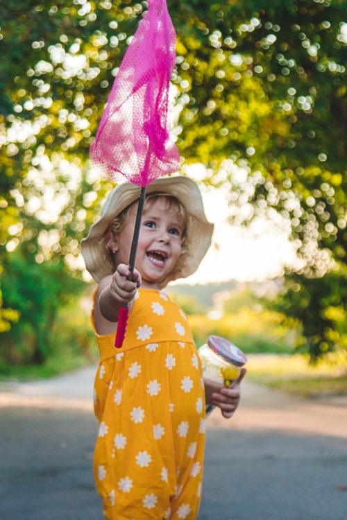 A child catches a butterfly in nature. selective focus. kid.