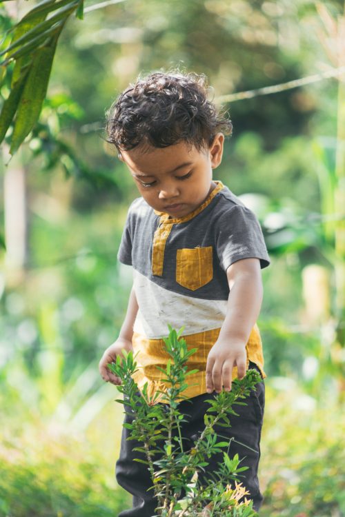 latin boy playing in nature,